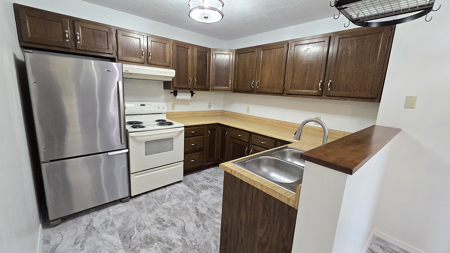 787 Walnut Hill Road Centralia, IL 62801 - Photo 23 of 42 a kitchen with stainless steel appliances granite countertop a sink stove and refrigerator
