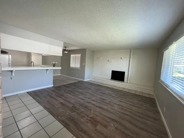 a view of a kitchen with a sink and a window