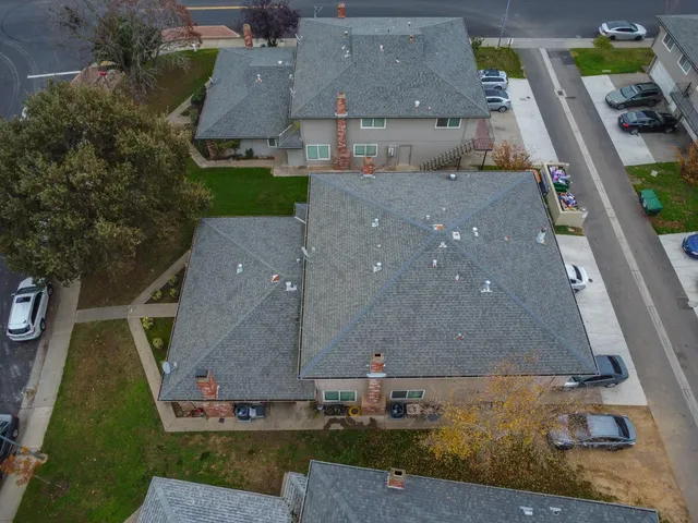 an aerial view of a house with a garden