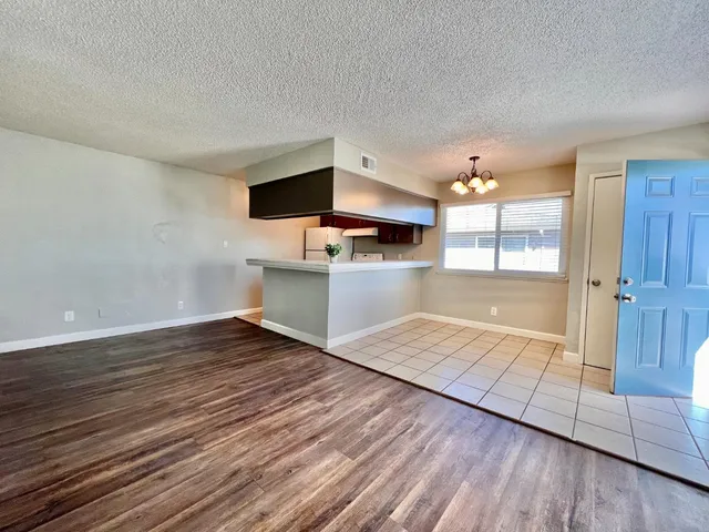 a view of a kitchen from the hallway