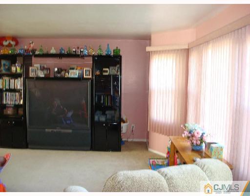 29 Haypress Road Dayton, NJ 08810 - Photo 3 of 10 a living room with furniture and a window