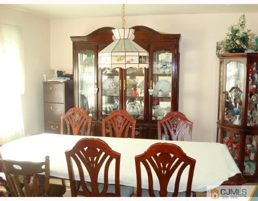 29 Haypress Road Dayton, NJ 08810 - Photo 4 of 10 a front view of a dining room with furniture window and wooden floor