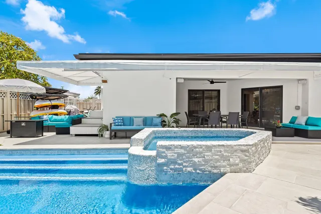 a view of a swimming pool with a patio