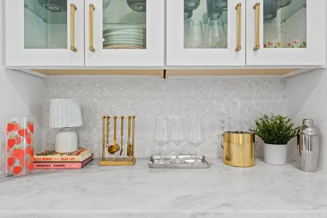 a large kitchen with stainless steel appliances granite countertop a sink and cabinets