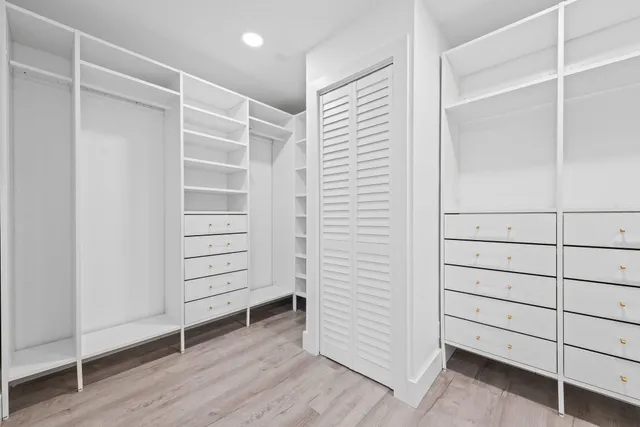 a view of a hallway with white walls