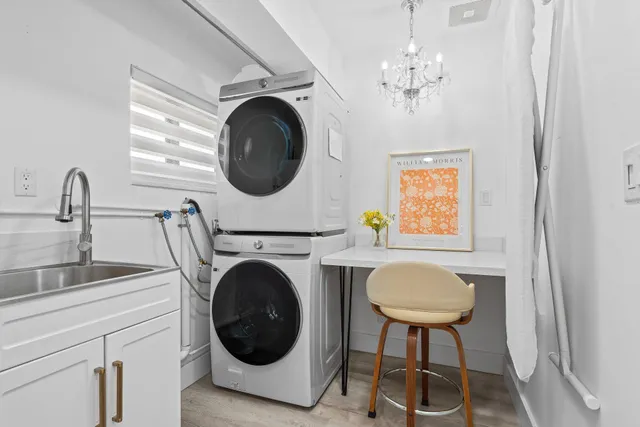 a bathroom with a granite countertop sink mirror vanity and toilet
