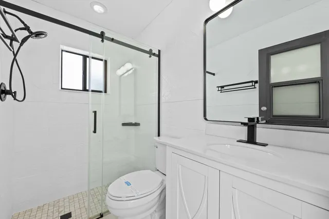 a house with green field in front of it