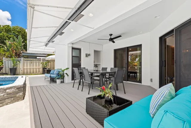 a view of a patio with couches table and chairs