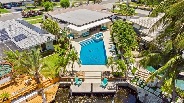 a bird view of multi story residential apartment building with yard