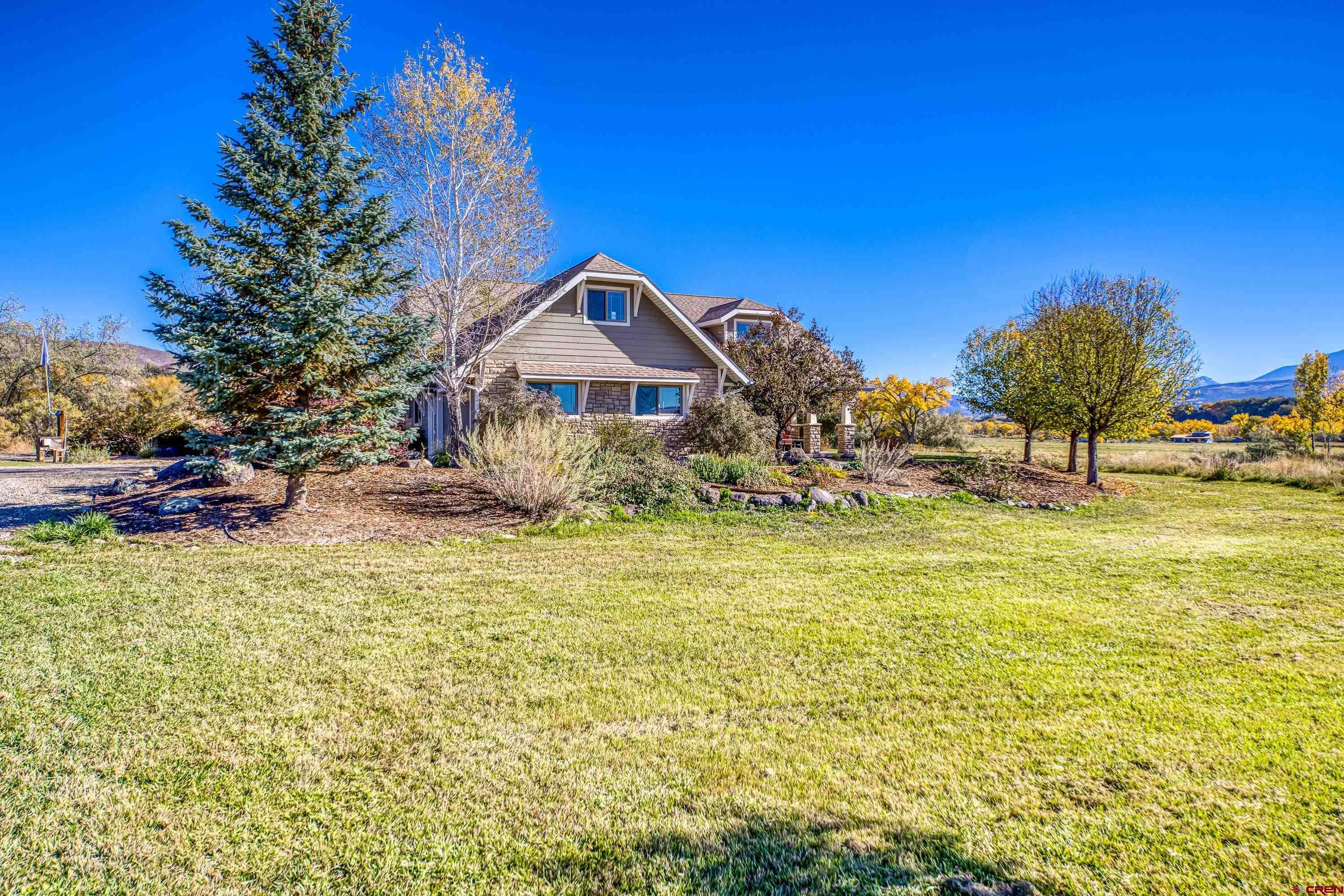 36639 M50 Road Hotchkiss, CO 81419 - Photo 12 of 45 a house view with a swimming pool