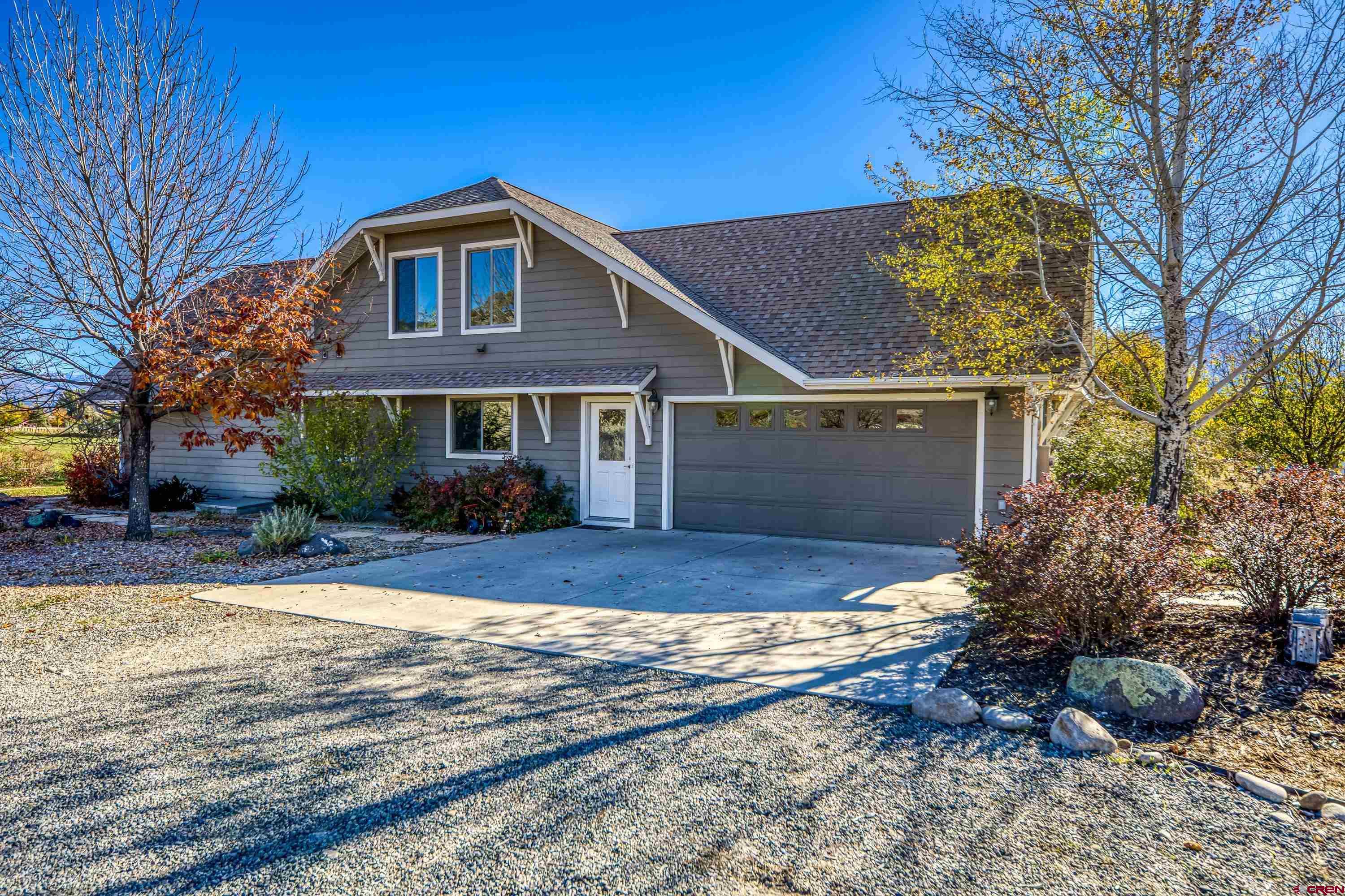 36639 M50 Road Hotchkiss, CO 81419 - Photo 13 of 45 a front view of house with yard and trees in the background