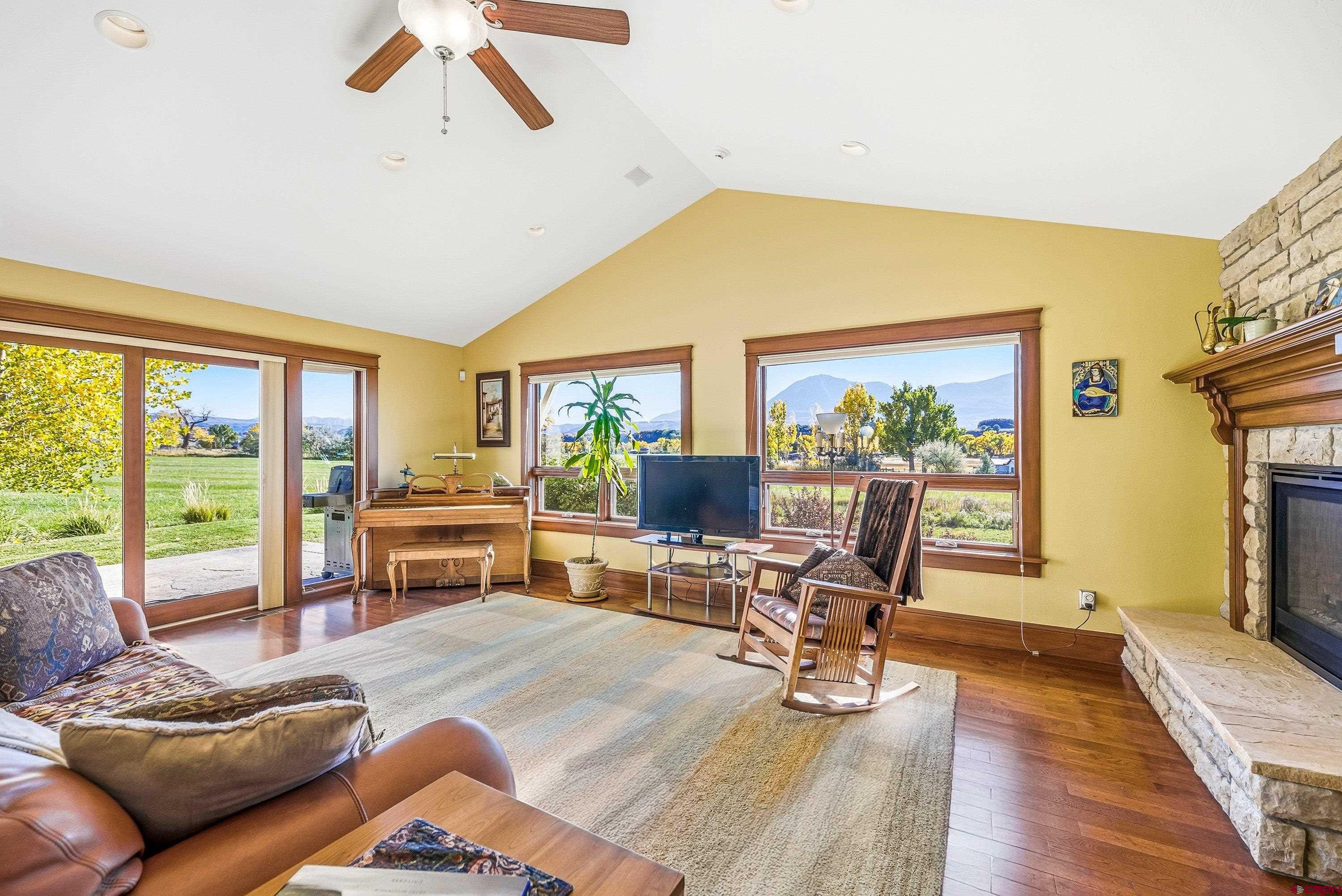 36639 M50 Road Hotchkiss, CO 81419 - Photo 17 of 45 a living room with furniture and a floor to ceiling window