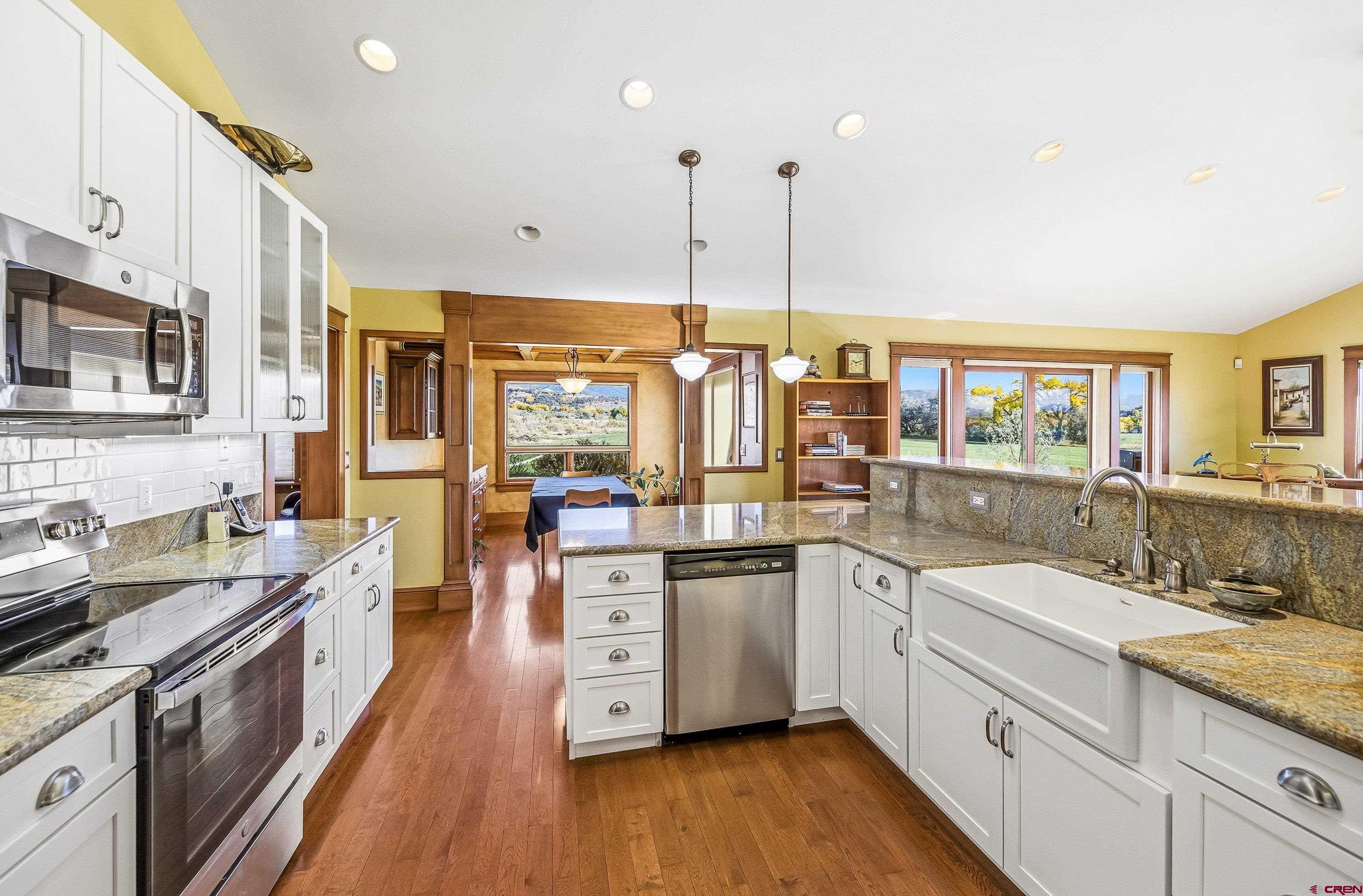 36639 M50 Road Hotchkiss, CO 81419 - Photo 19 of 45 a kitchen with stainless steel appliances granite countertop a sink stove and refrigerator