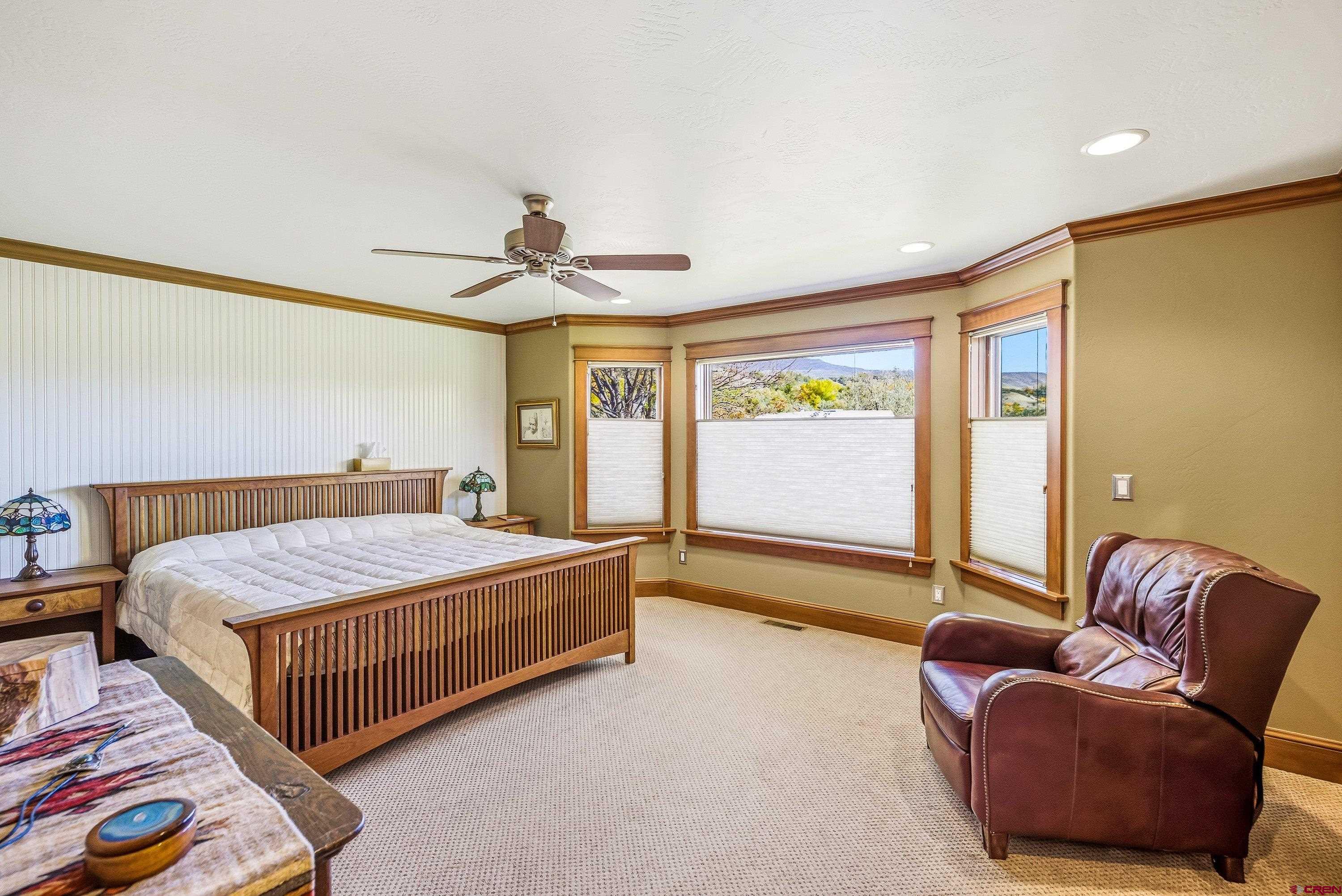 36639 M50 Road Hotchkiss, CO 81419 - Photo 27 of 45 a bedroom with a bed couch and window