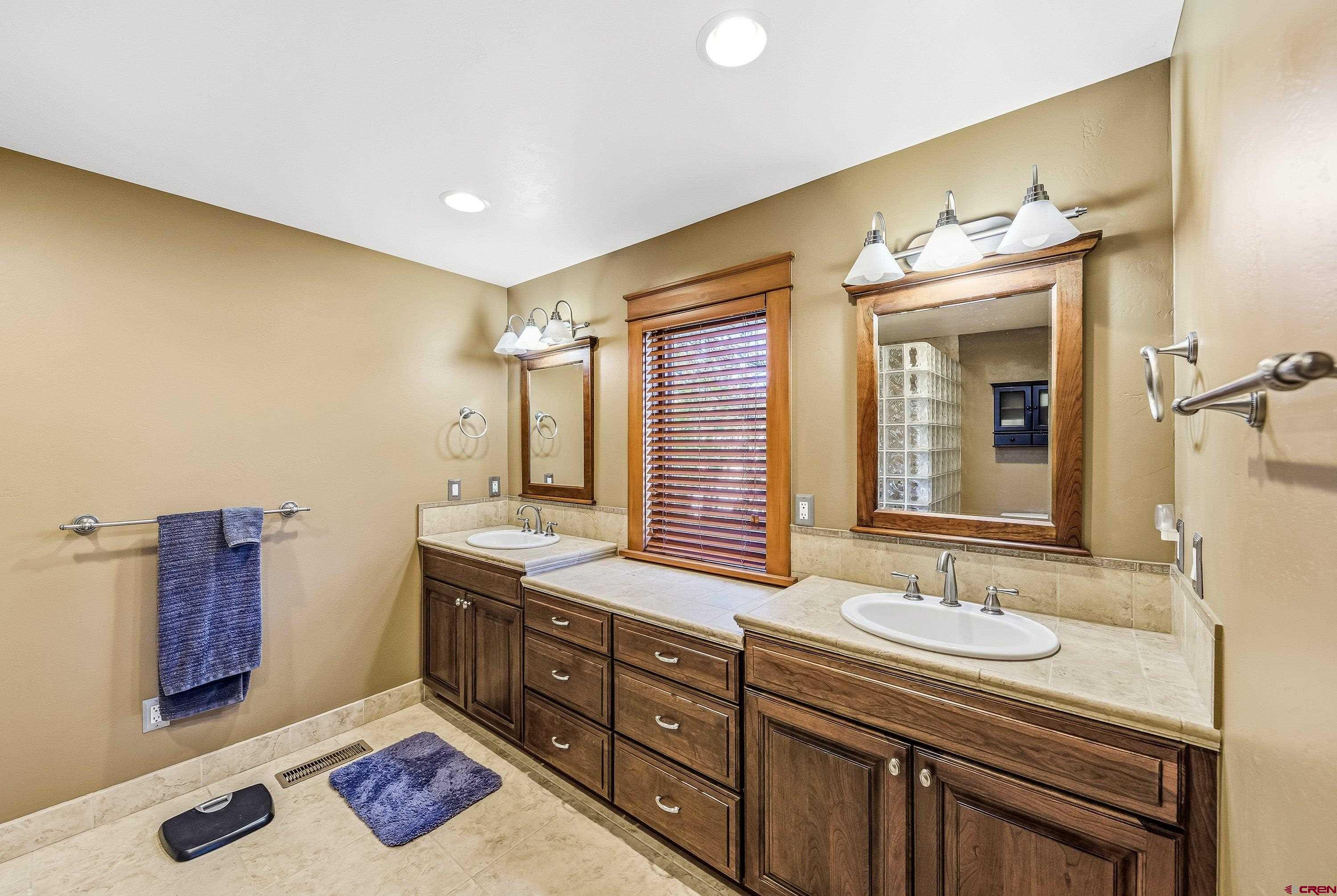 36639 M50 Road Hotchkiss, CO 81419 - Photo 30 of 45 a bathroom with a sink double vanity and a mirror