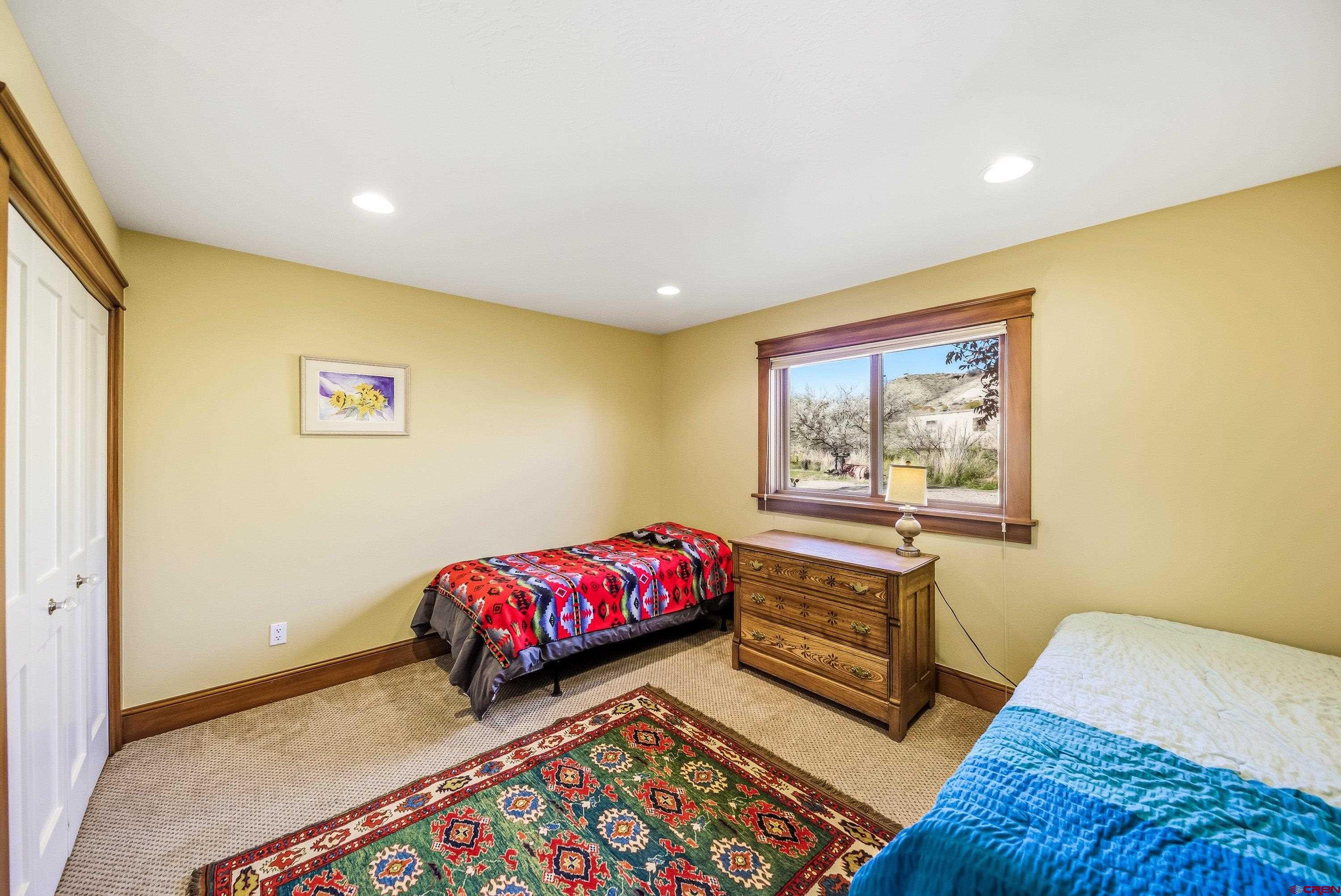 36639 M50 Road Hotchkiss, CO 81419 - Photo 33 of 45 a bedroom with a bed and a window