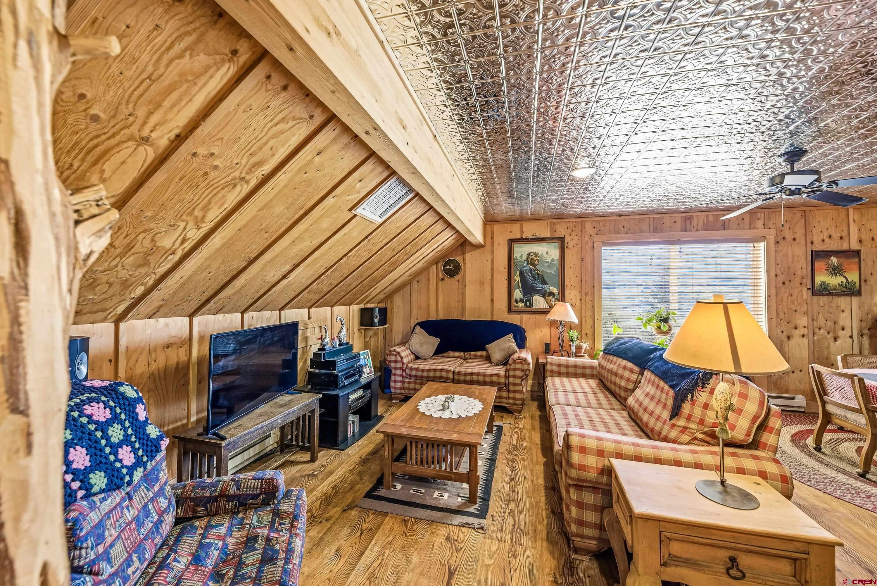 36639 M50 Road Hotchkiss, CO 81419 - Photo 40 of 45 a view of a balcony with chairs and wooden floor