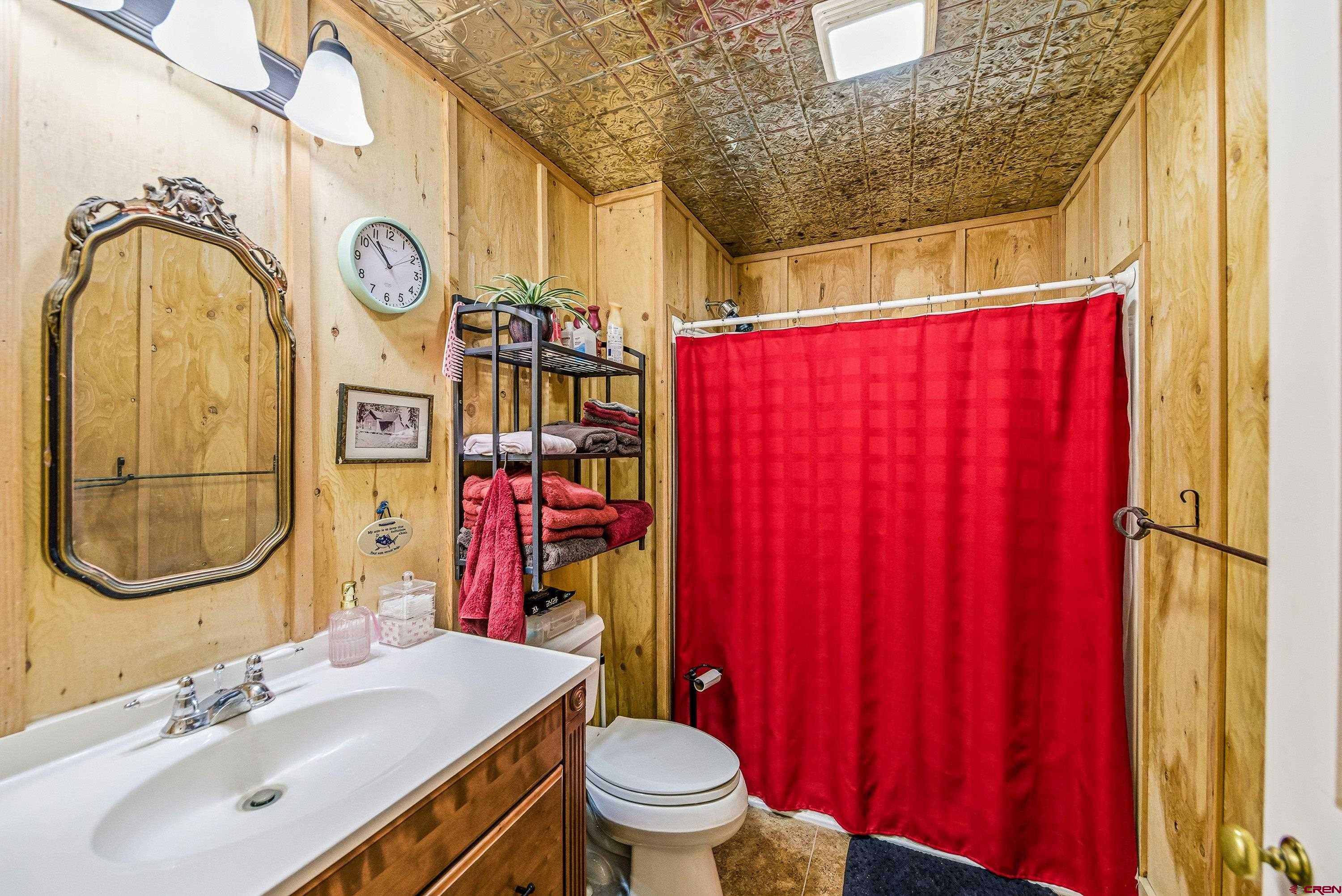 36639 M50 Road Hotchkiss, CO 81419 - Photo 45 of 45 a bathroom with a sink a toilet and a mirror