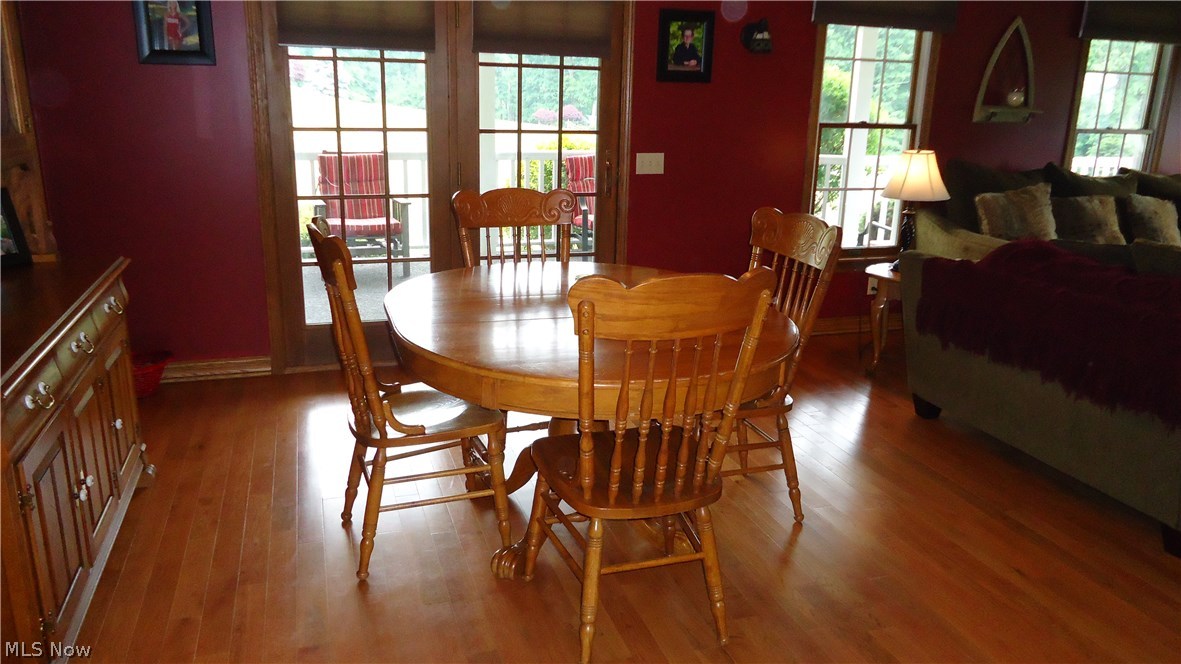 11720 Walker Road Minerva, OH 44657 - Photo 4 of 21 dining area, hard wood floors, doors to wrap around porch, adorable!