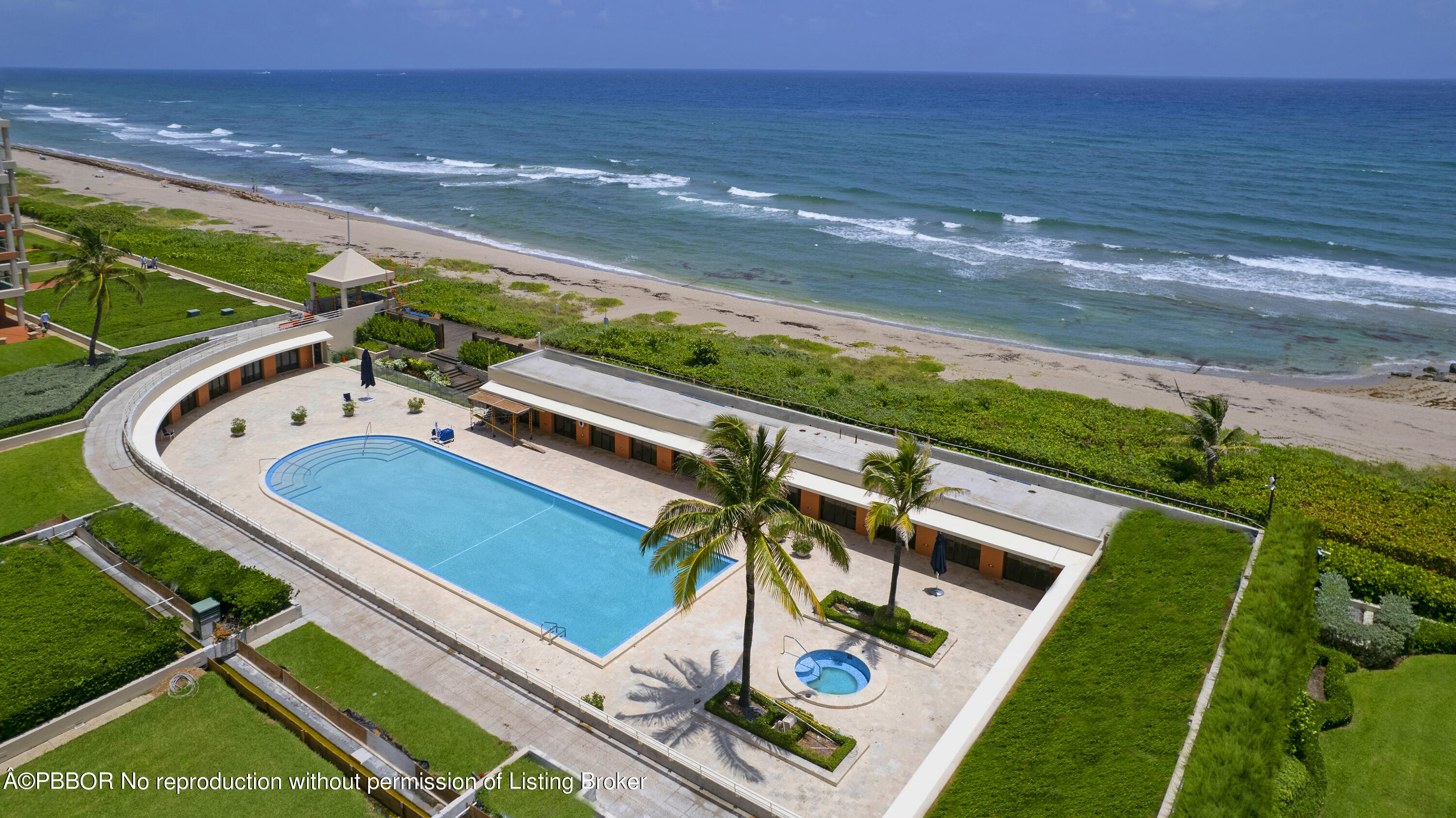 2 North Breakers Row, Unit S43 Palm Beach, FL 33480 - Photo 17 of 37 a view of a backyard with lawn chairs wooden floor and ocean view