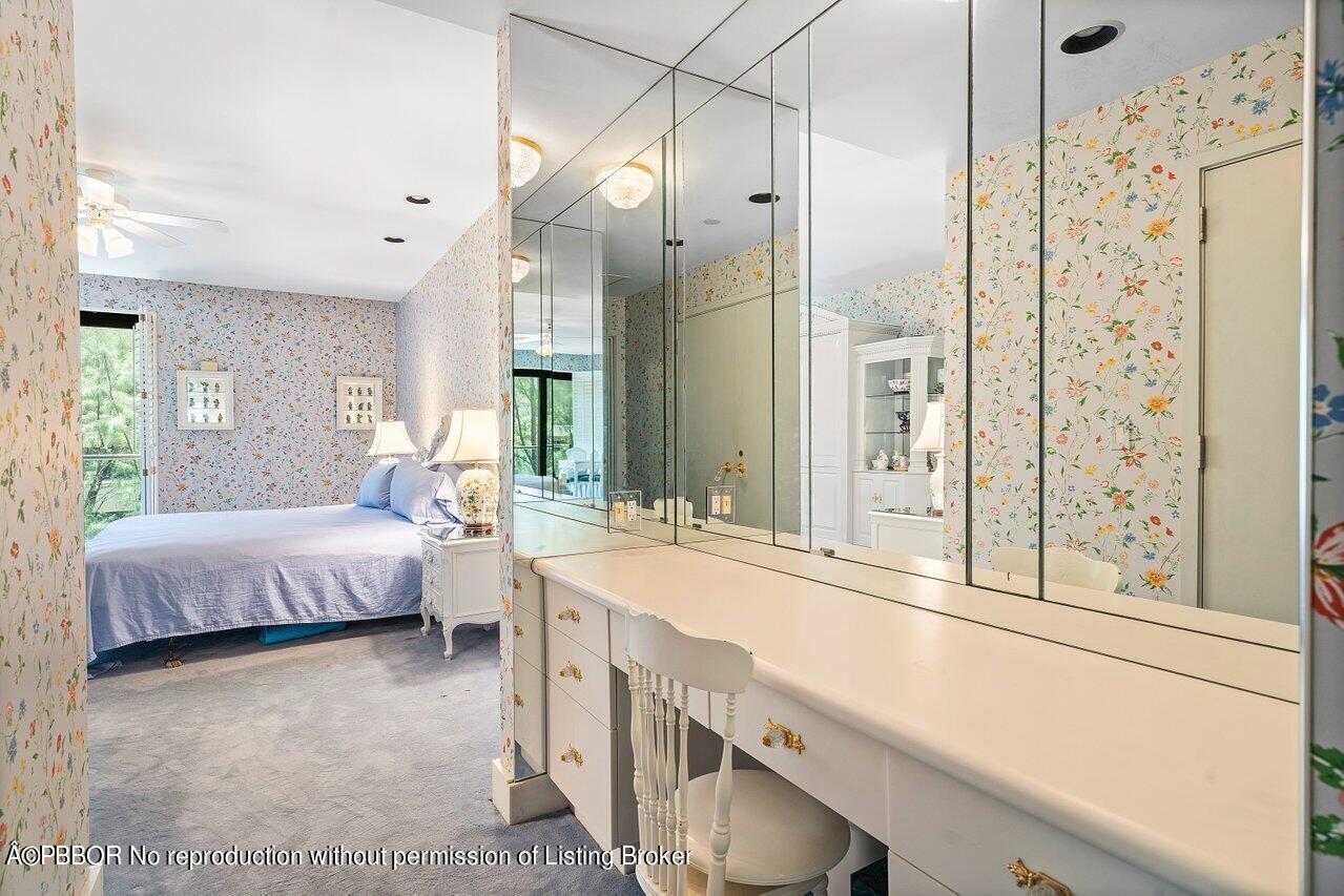 2 North Breakers Row, Unit S43 Palm Beach, FL 33480 - Photo 28 of 37 a spacious bathroom with a granite countertop sink and a mirror