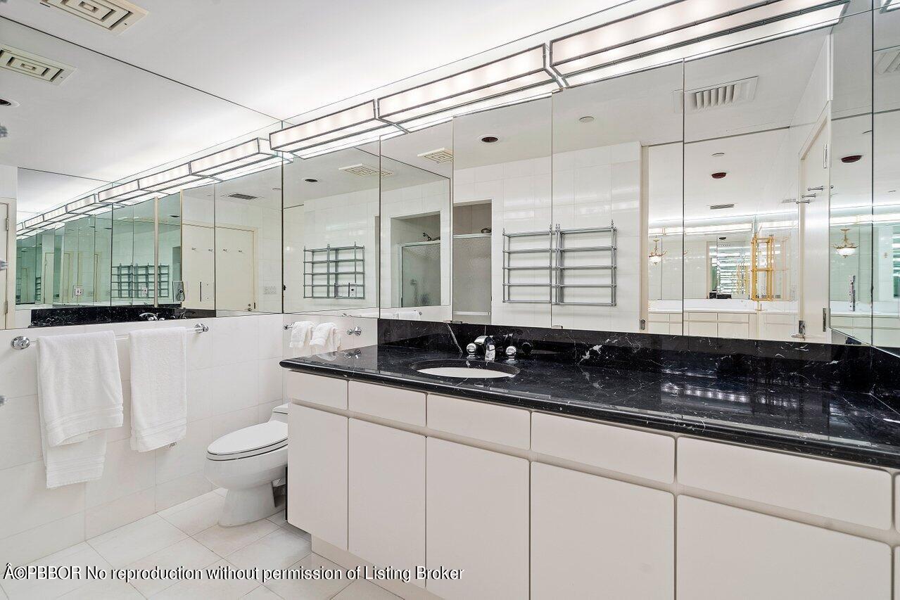 2 North Breakers Row, Unit S43 Palm Beach, FL 33480 - Photo 32 of 37 a bathroom with double sink and a mirror