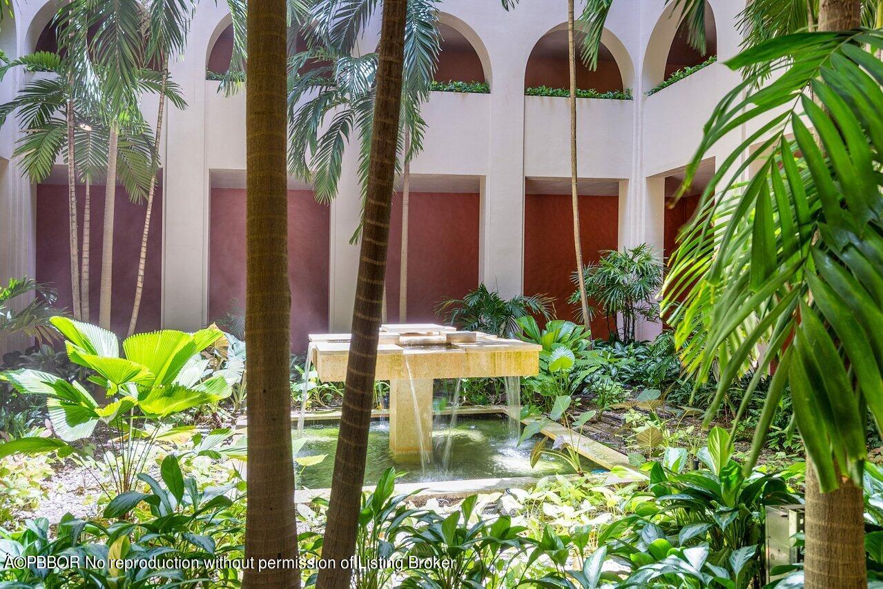 2 North Breakers Row, Unit S43 Palm Beach, FL 33480 - Photo 8 of 37 a view of a patio with table and chairs and potted plants