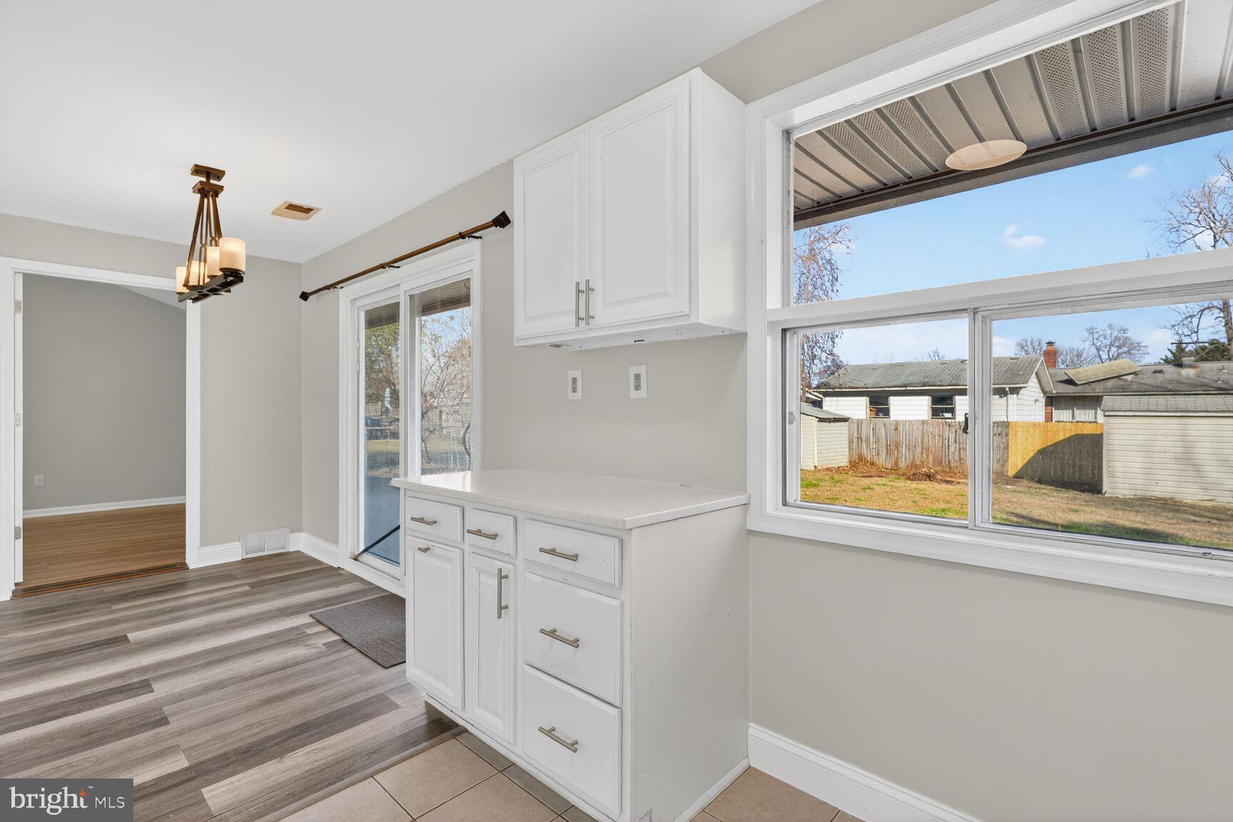 6307 Cottonwood Drive Alexandria, VA 22310 - Photo 13 of 28 a view of a kitchen with wooden floor and staircase
