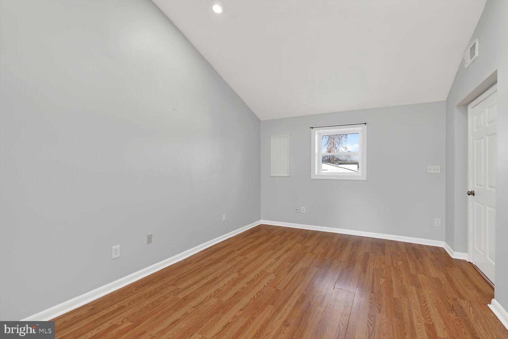 6307 Cottonwood Drive Alexandria, VA 22310 - Photo 15 of 28 a view of a room with wooden floor and white walls
