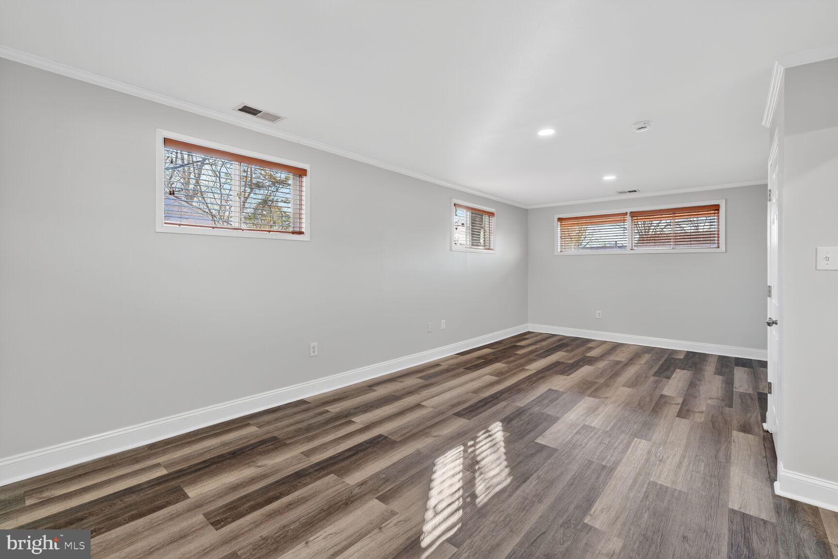 6307 Cottonwood Drive Alexandria, VA 22310 - Photo 21 of 28 a view of empty room with wooden floor