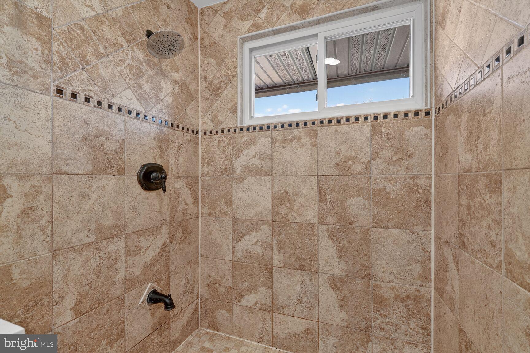 6307 Cottonwood Drive Alexandria, VA 22310 - Photo 25 of 28 a bathroom with a shower