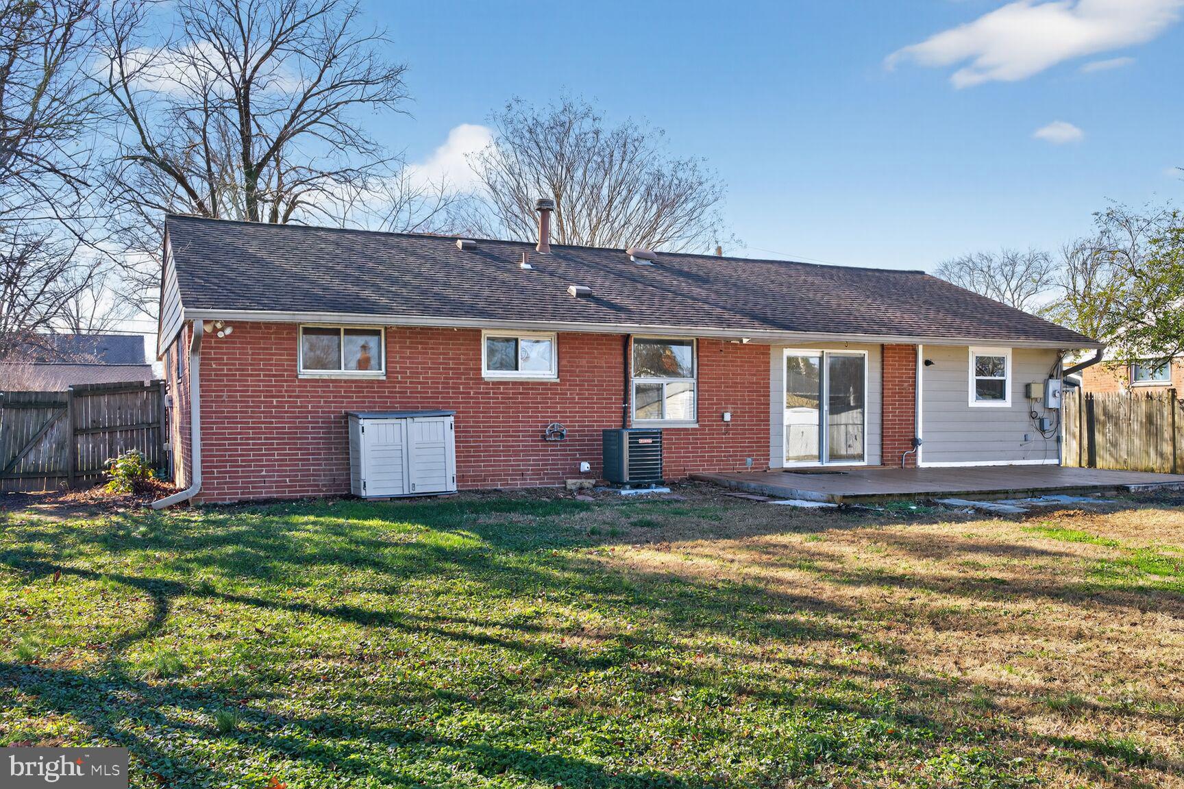 6307 Cottonwood Drive Alexandria, VA 22310 - Photo 27 of 28 a view of a yard in front of a house with large trees