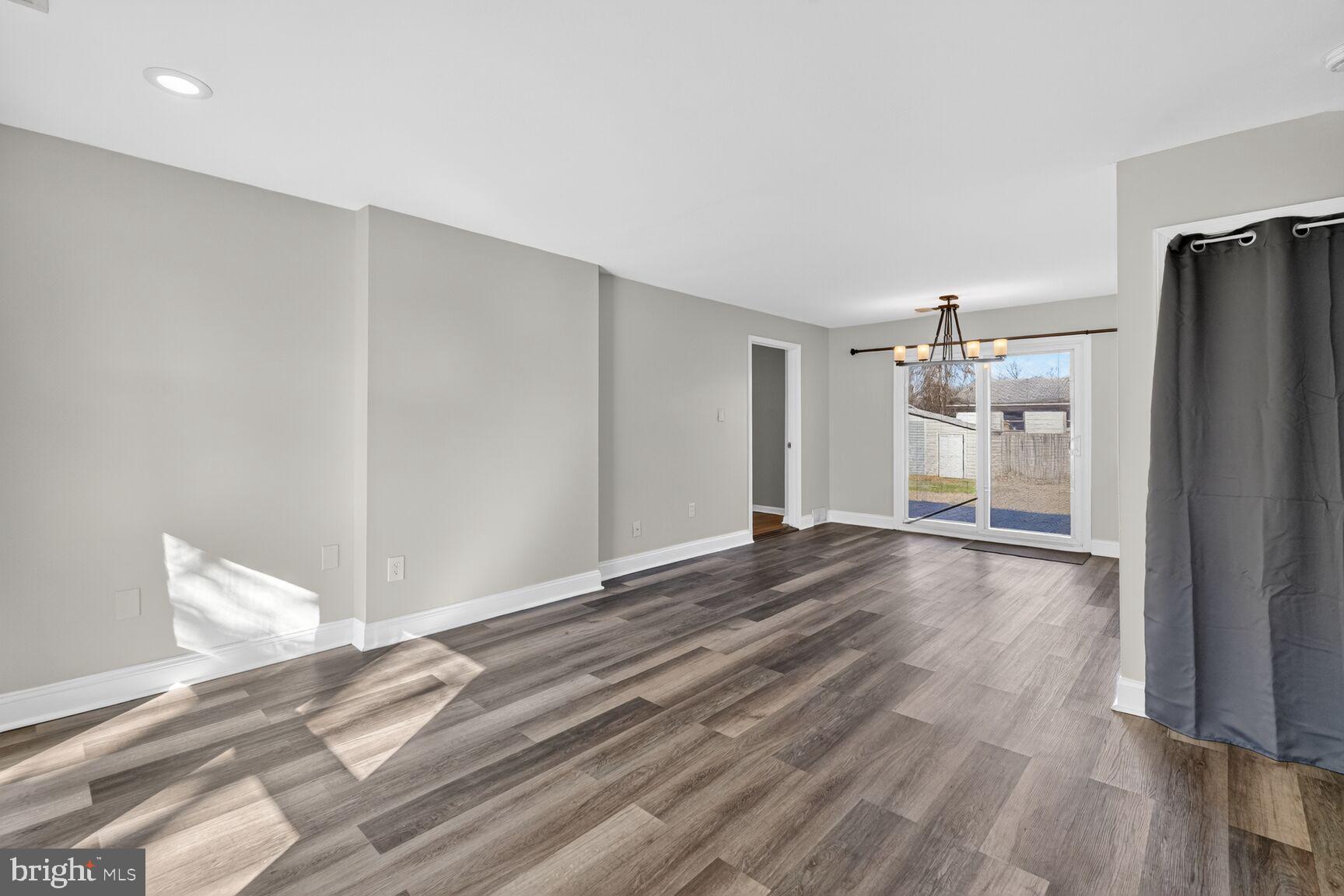 6307 Cottonwood Drive Alexandria, VA 22310 - Photo 3 of 28 a view of a livingroom with wooden floor