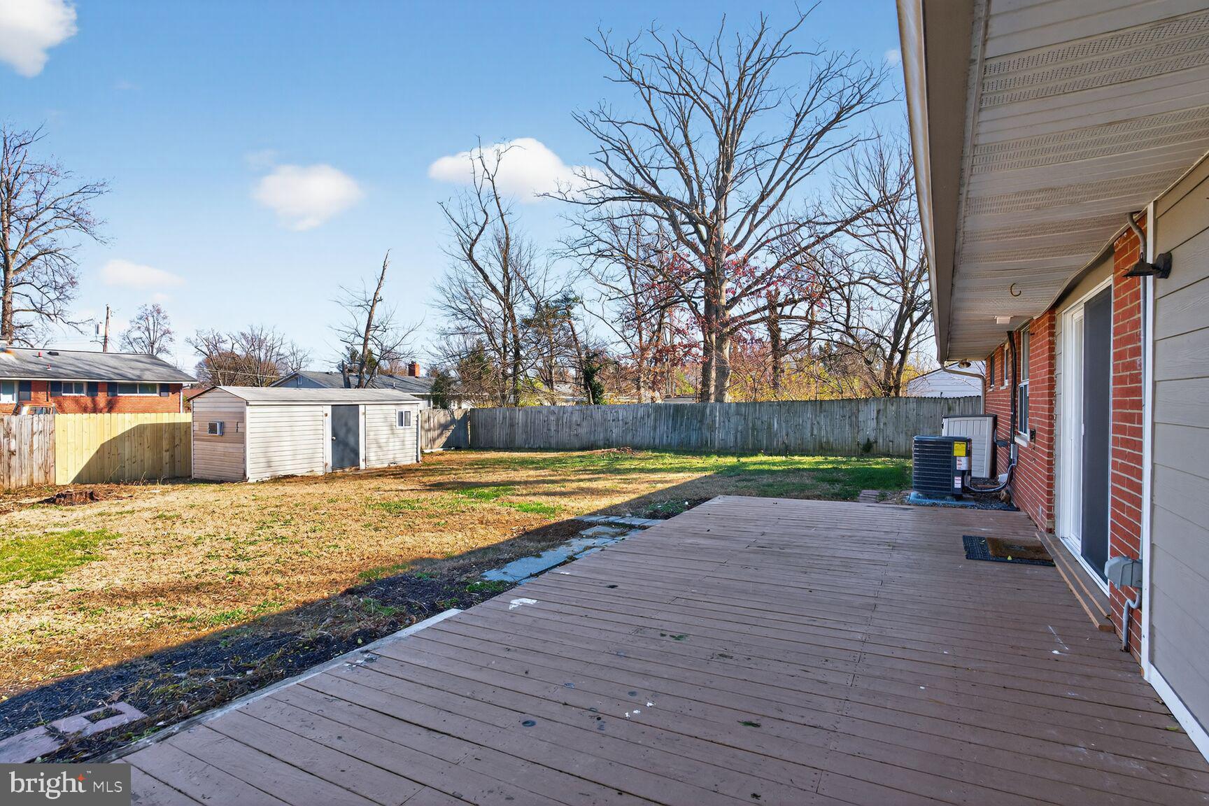 6307 Cottonwood Drive Alexandria, VA 22310 - Photo 8 of 28 a view of a swimming pool with a patio and a yard