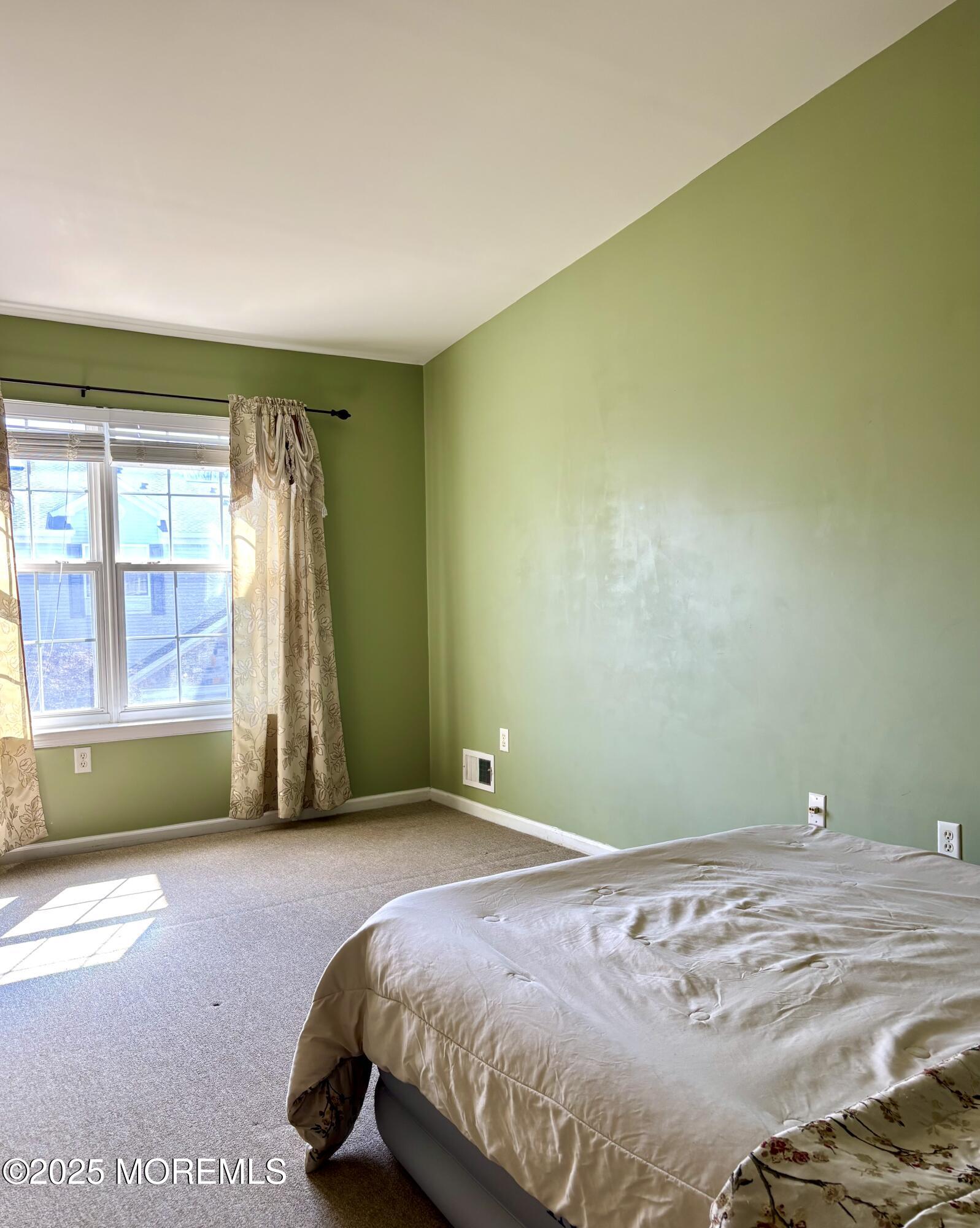 39 Rozalyn Lane, Unit 141 South Amboy, NJ 08879 - Photo 11 of 18 a bedroom with a bed and a window