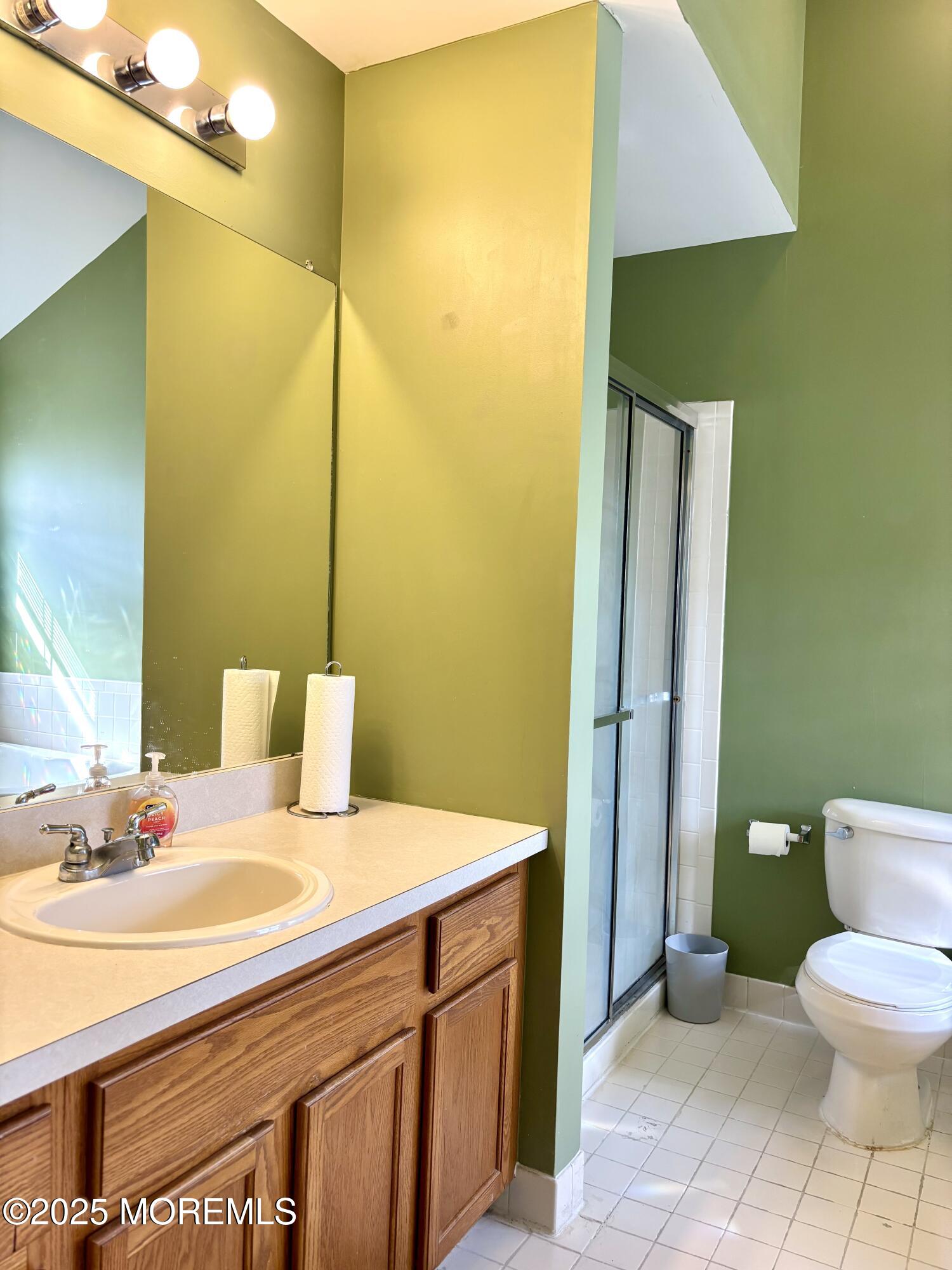 39 Rozalyn Lane, Unit 141 South Amboy, NJ 08879 - Photo 12 of 18 a bathroom with a sink and a mirror