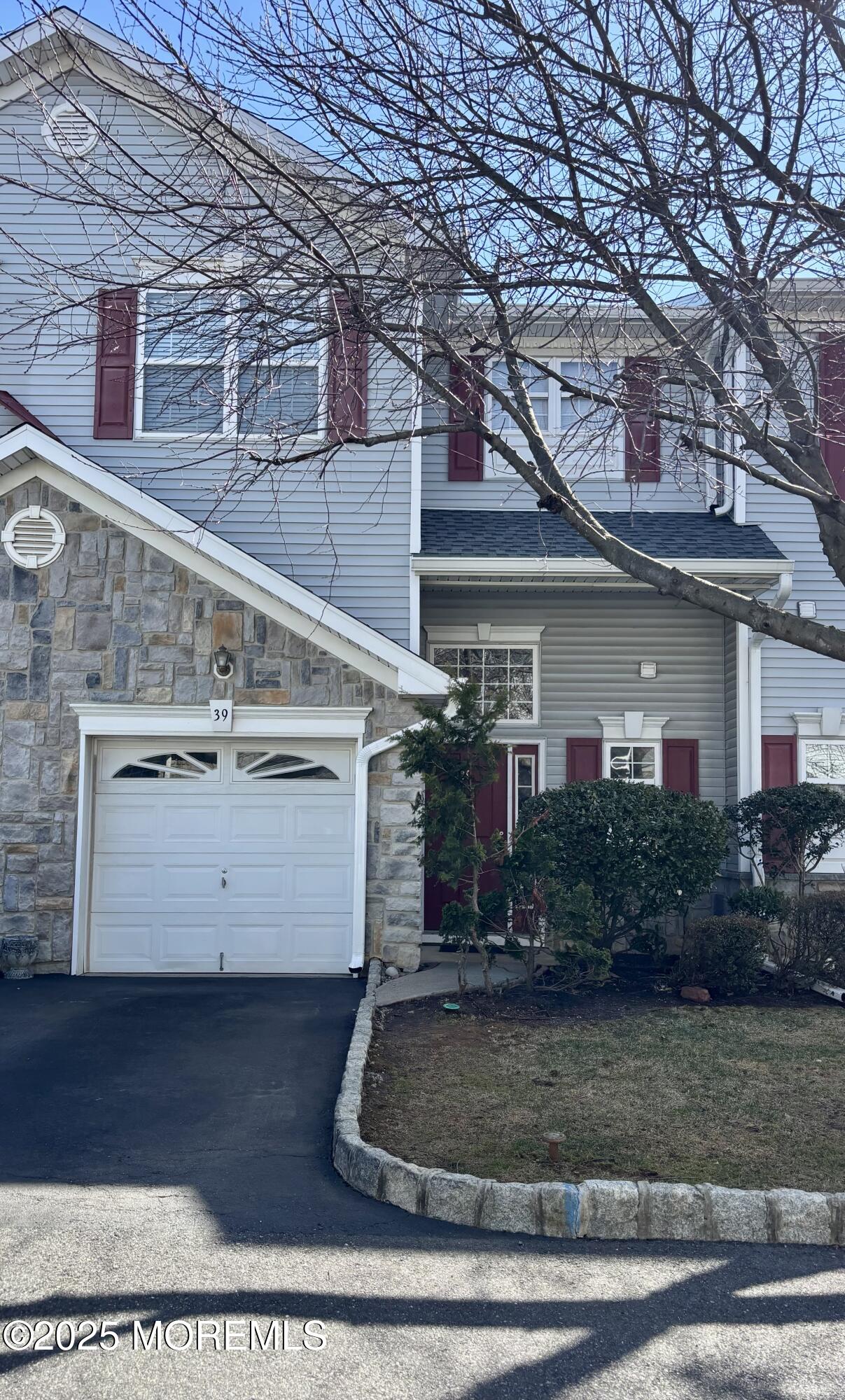 39 Rozalyn Lane, Unit 141 South Amboy, NJ 08879 - Photo 15 of 19 a view of a white house with large windows