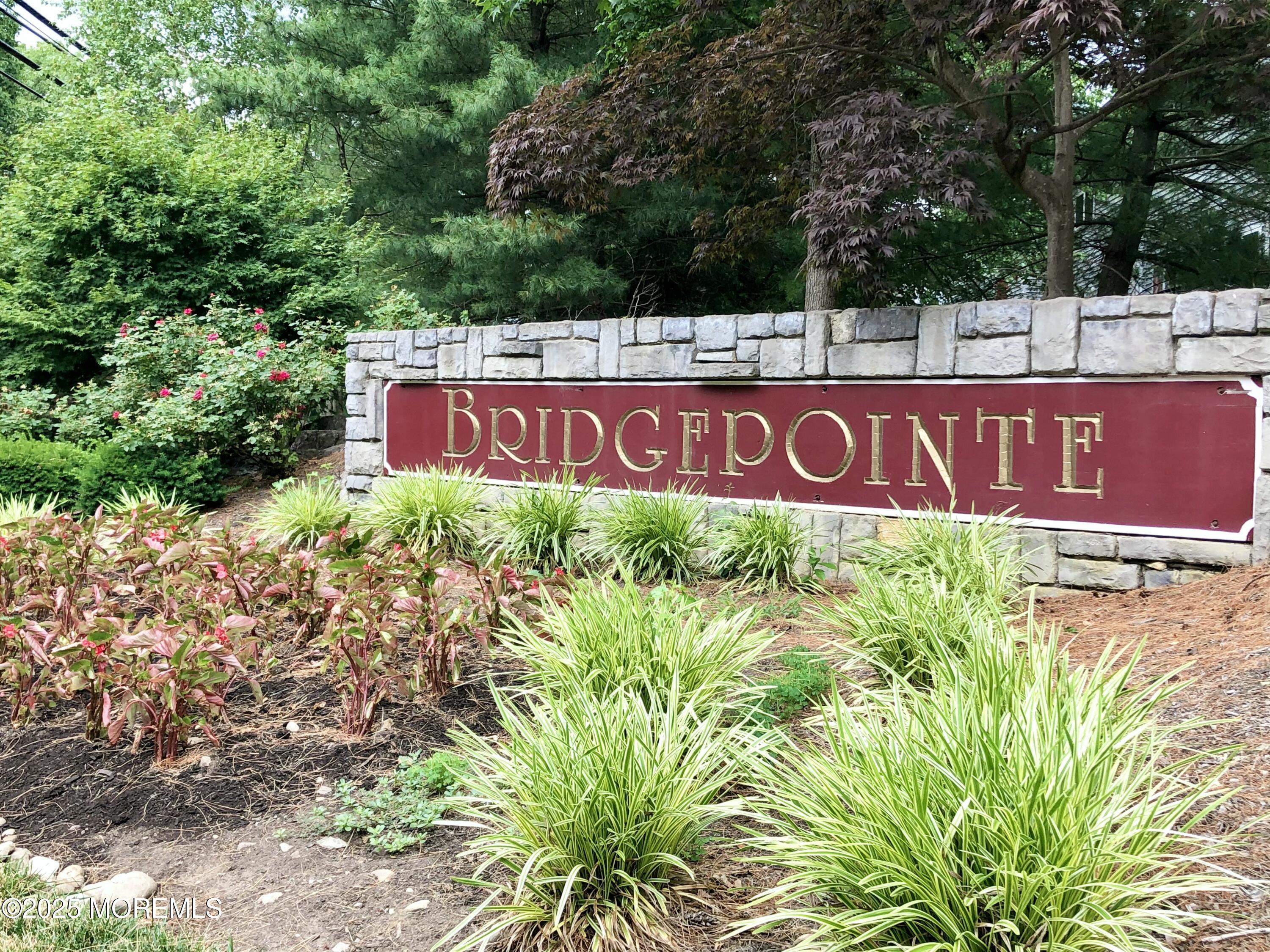 39 Rozalyn Lane, Unit 141 South Amboy, NJ 08879 - Photo 18 of 18 a sign that is sitting in front of flowers