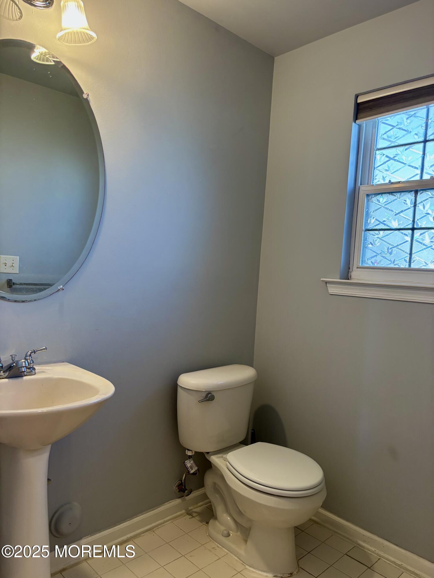 39 Rozalyn Lane, Unit 141 South Amboy, NJ 08879 - Photo 4 of 19 a white toilet sitting next to a bathroom sink