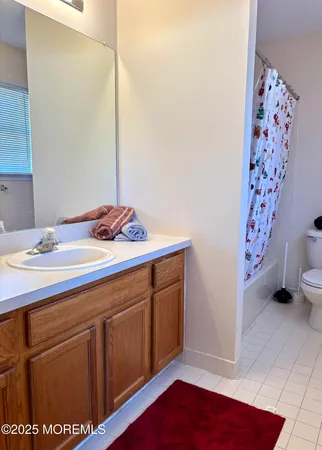 a room with a sink and a mirror