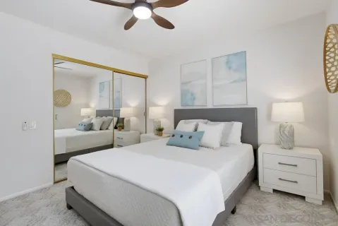 a bedroom with a bed and a dresser