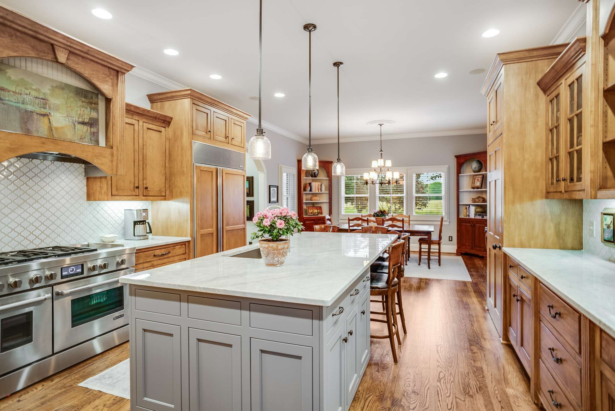 1539 Palmer Road Lebanon, TN 37090 - Photo 26 of 70 a kitchen with stainless steel appliances granite countertop a stove a sink a oven a dining table and chairs with wooden floor