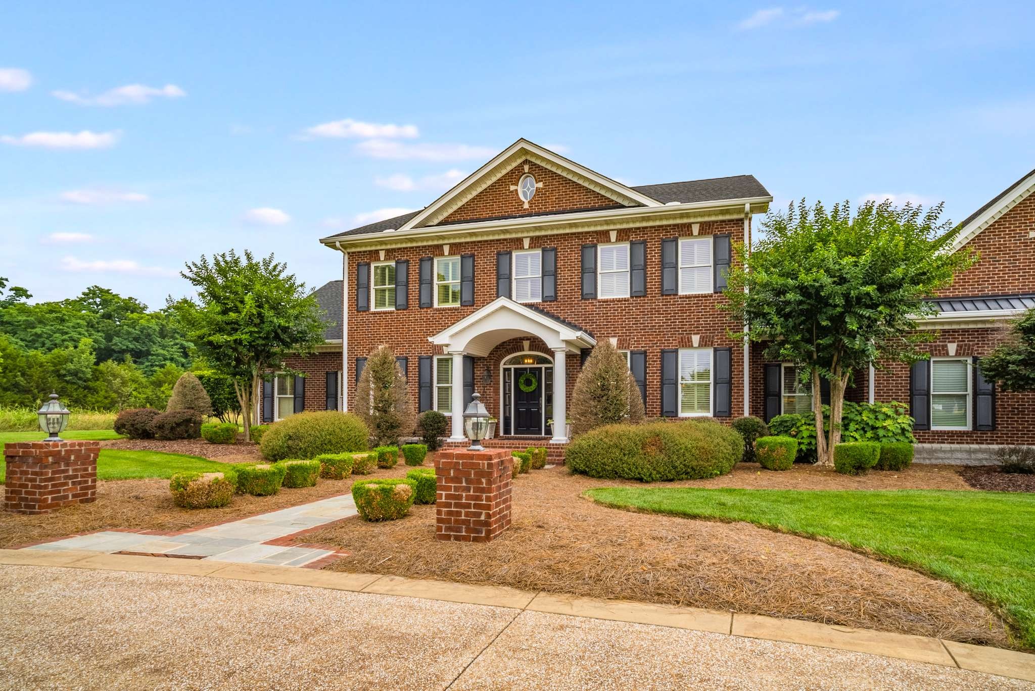 1539 Palmer Road Lebanon, TN 37090 - Photo 5 of 70 a front view of a house with a garden