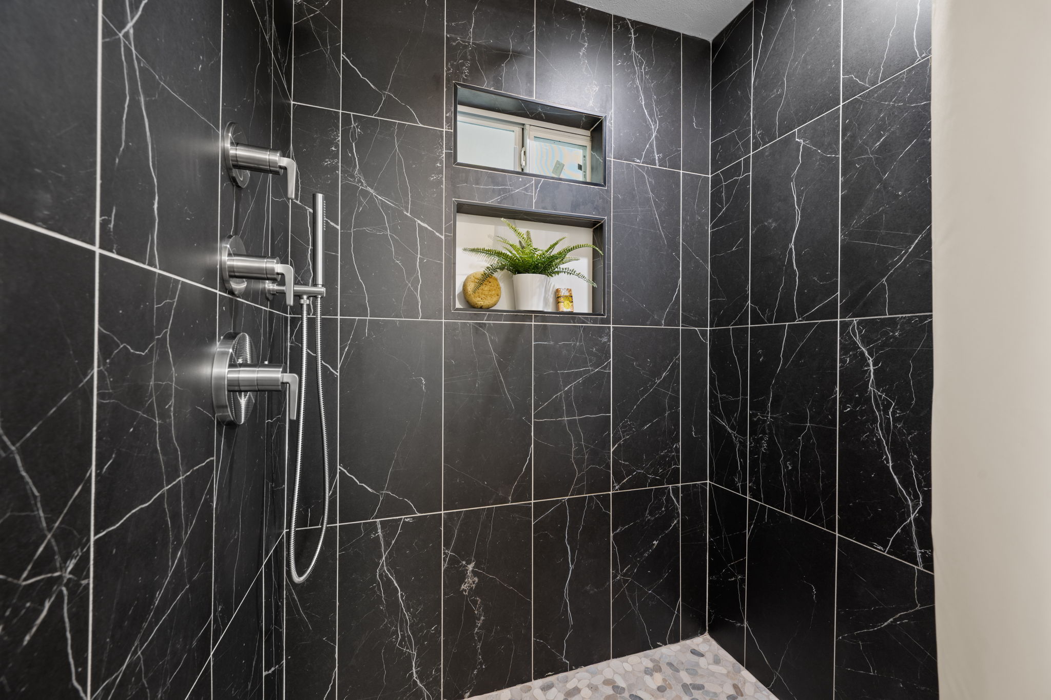 4711 Bandera Road Austin, TX 78721 - Photo 13 of 22 a bathroom with a shower and a sink