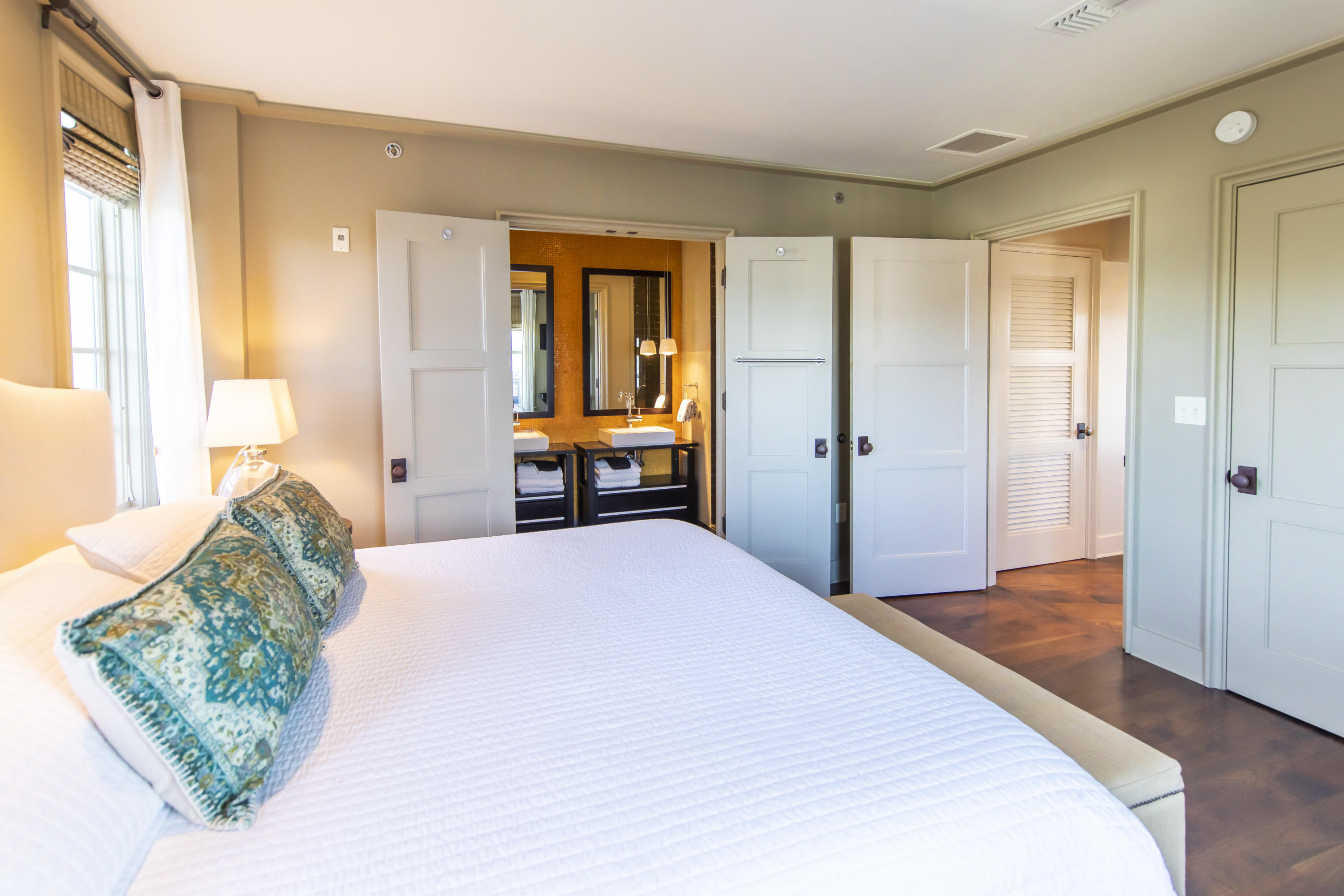 78 North Barrett Square, Unit 5 Inlet Beach, FL 32461 - Photo 7 of 25 a spacious bedroom with a bed and wooden floor