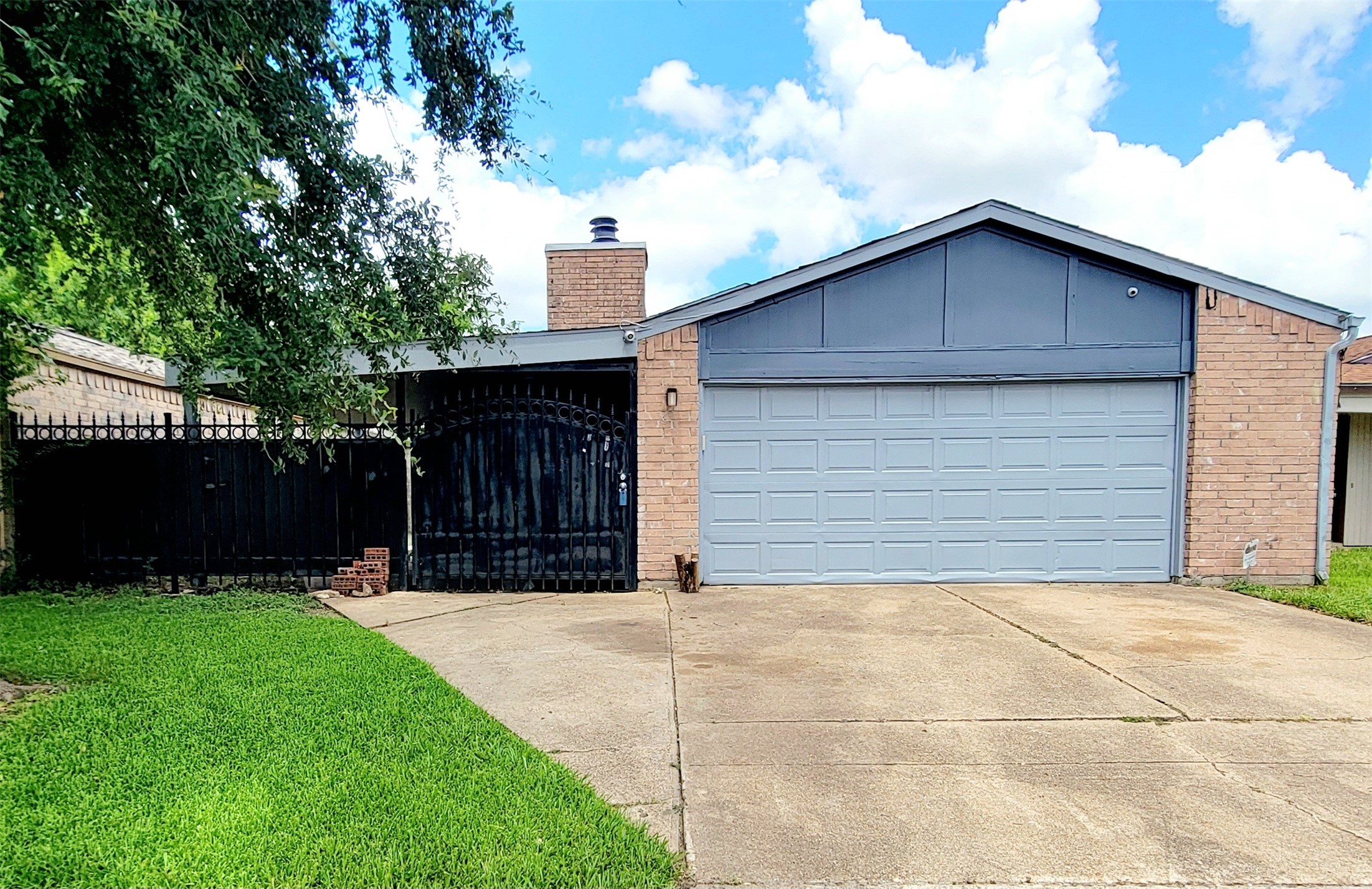 4170 Amir Street Houston, TX 77072 - Photo 1 of 10 a view of house with backyard and garden