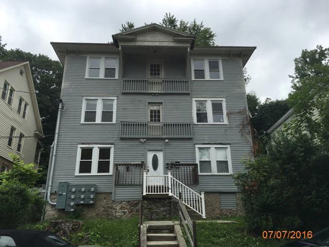 14 North Spring Street Ansonia, CT 06401 - Photo 1 of 1 a front view of a house with a yard