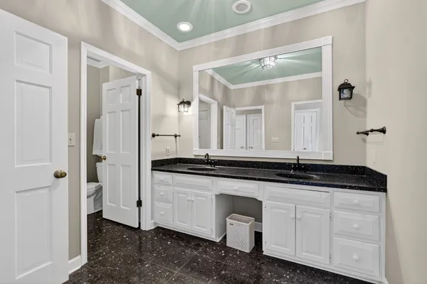 a utility room with sink dryer and washer