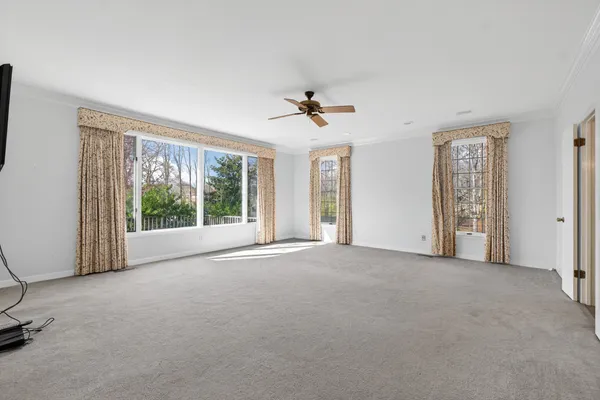 a view of a hallway with furniture and entryway