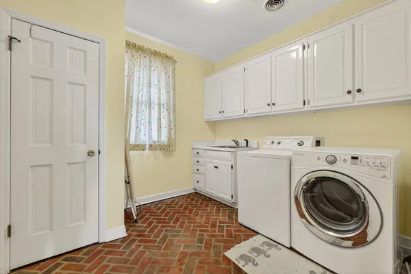 an empty room with a ceiling fan and a window